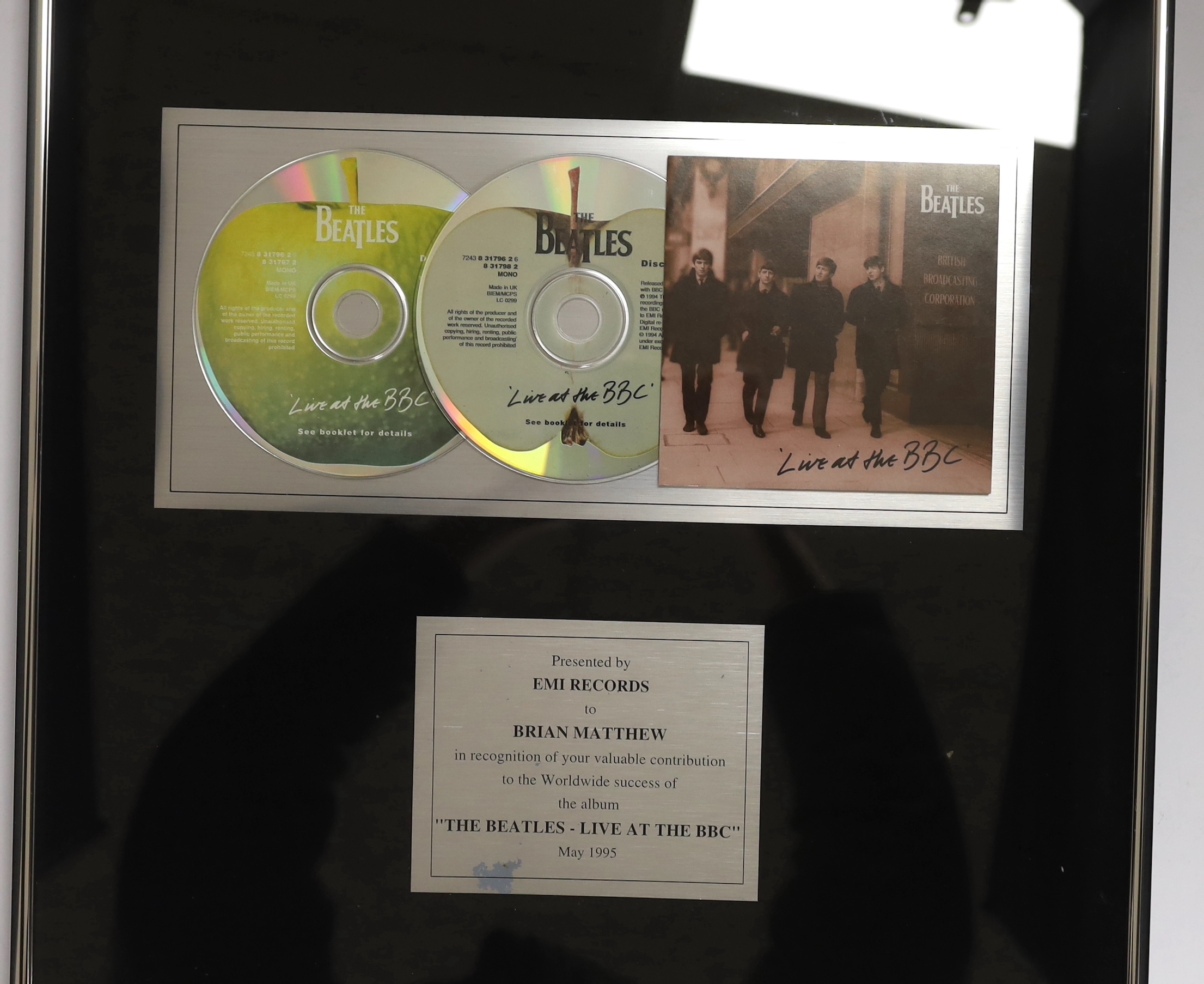 Three framed BBC related presentations to the BBC DJ Brian Matthew; ‘The Beatles - Live at the BBC’, presented by EMI Records, Top of the Pops presented to mark the 1000th edition (28.11.83), Top of the Pops, presented t